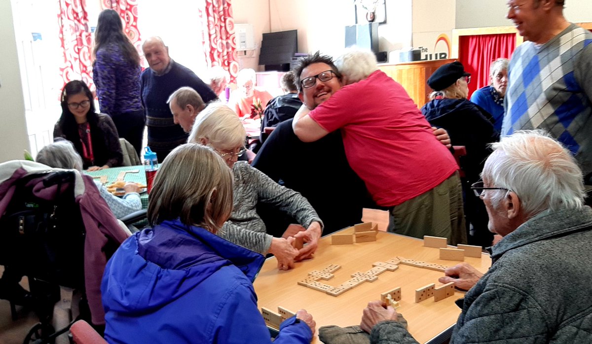 DDCmanager's tweet photo. Thanks for great sports, two staff from @TNLComFund visiting our new #socialprescribing #cafeextra in #kirkburton today. Playing dominos with the lively #dementia group - they loved you guys, Rob and Stephanie! Thanks for coming and experiencing us tackling #kirkleesloneliness https://t.co/0iMXNwBRdU