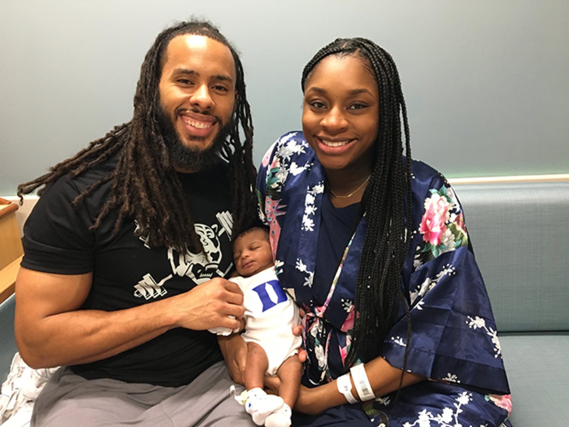 DukeAlumni's tweet photo. This sweet #DukeBaby is already ready for #DukeDay. This cutie was born to Preston Scott โ12 and Imara-Safi Scott โ12 and was Duke Hospitalโs first baby on 2/29. #LeapDay! Super mom, Imara is currently a Duke resident in Dermatology. #ForeverDuke @dukeobgyn @DukeHospital https://t.co/NT3mHkaDGs