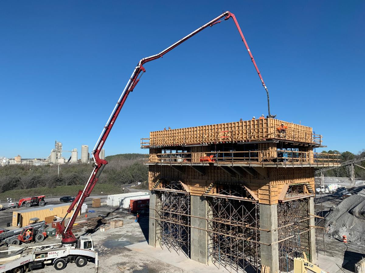 1/2: A great pic of a concrete pump truck being used to place concrete for an elevated pour at the Killm 5 Superstructure jobsite in Birmingham. #concrete #geotechnical #engineering