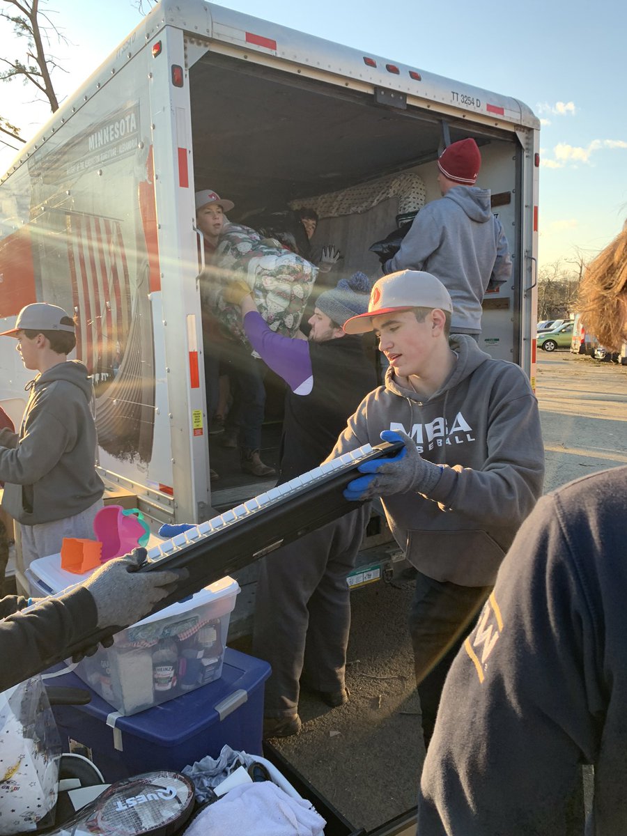 MicrobeBaseball's tweet photo. The boys spent the afternoon helping families move from homes damaged by the tornado. #webeliveinnashville https://t.co/8ug0poi4cL