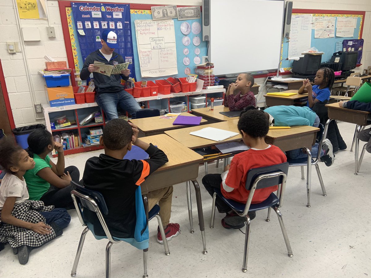 MsWinstead's tweet photo. Second grade has been waiting all year for this. We finally had a very special visitor and he decided not just to visit but to disrupt and come read to both classes.  Thank you so much for your service and your disruption! #ReadAcrossAmerica @EMRollinsElem https://t.co/q28TJ4u7kJ