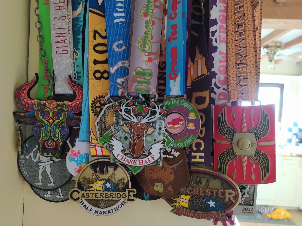 DorsetCatriona's tweet photo. A new medal for my @GHMarathon #LarmerTree collection and one more for the medal rack. A great run in near perfect conditions https://t.co/ftr3oZMVhp