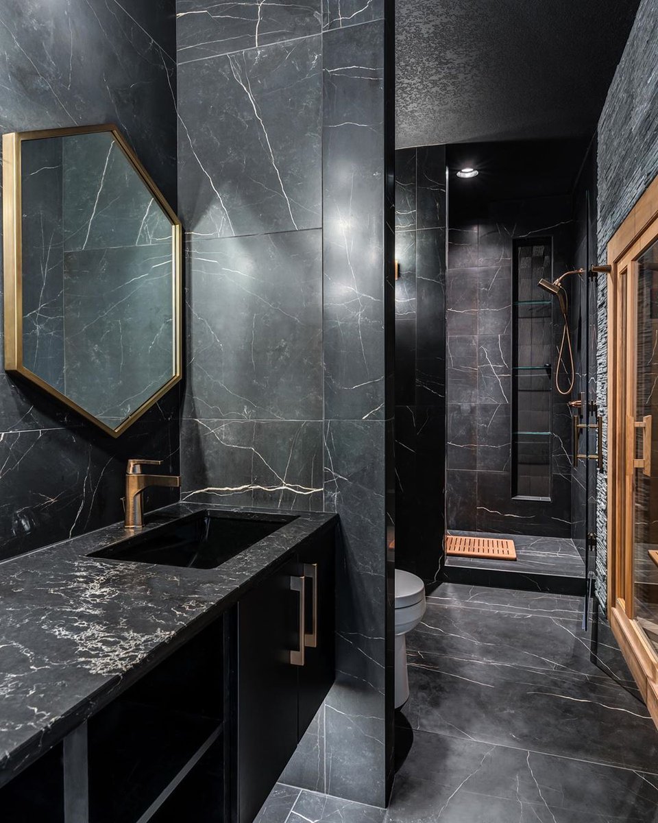 Excuse us while we pick our jaws up from the floor! What's not to love about this dark, sleek, stunning bathroom designed by April Ford with Kimberley Development Corporation?! 
#repost #bertch #bertchcabinets #americanmade #usa #bathroom