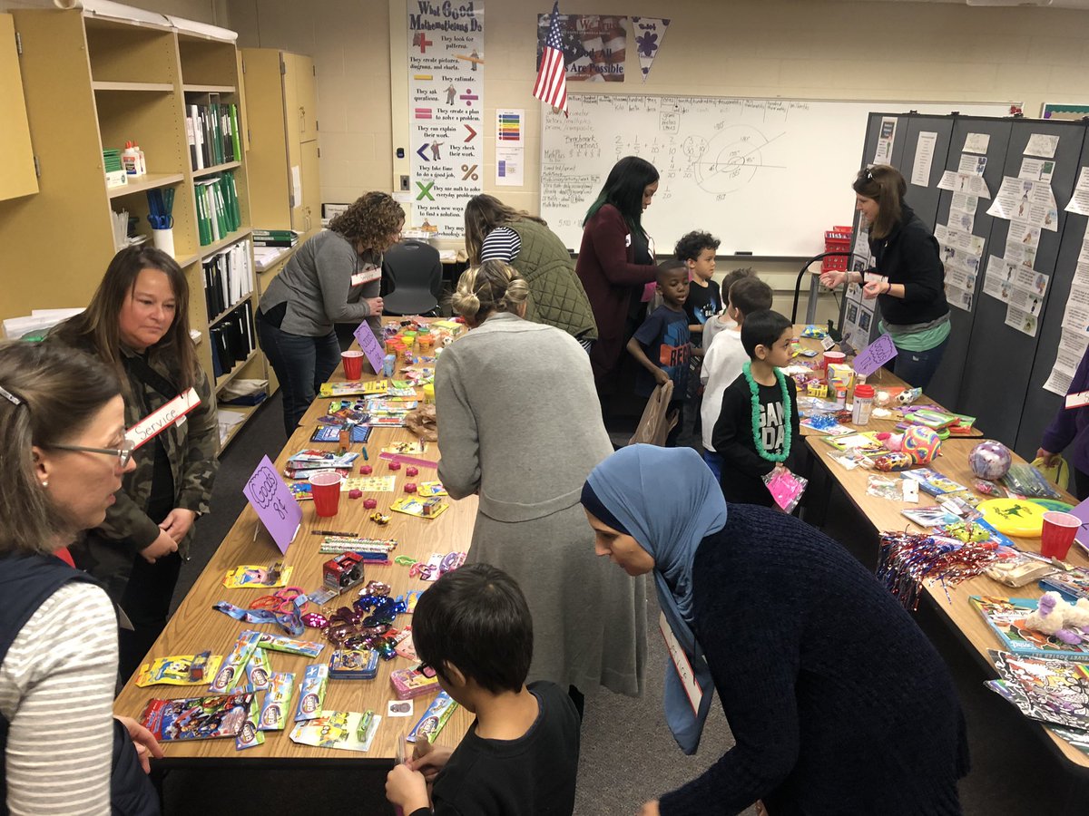 MrsPodgurski's tweet photo. It’s that time of the year again!! 1st graders got to shop at the Violet Mart to culminate our economics unit. We couldn’t make this happen without the help of parents and their generous donations! #awesomeparents https://t.co/ix6Q3SZw7h