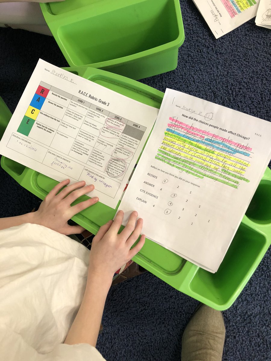 Students use R.A.C.E. as a strategy to answer questions after they closely read an article on the choices people made that affected Chicago back in the late 1800’s. Students are evaluating each other’s responses using a rubric while giving feedback! <a href="/D45Westmore/">Westmore School</a> <a href="/D45Schools/">School District 45</a>