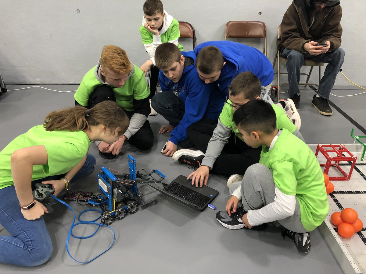 Love the collaboration between teams in VEX IQ! Here are the RATZ from South Middle School conferring with a team from Ripley WV at the WV State Tournament on the best way to fix a controller issue.
