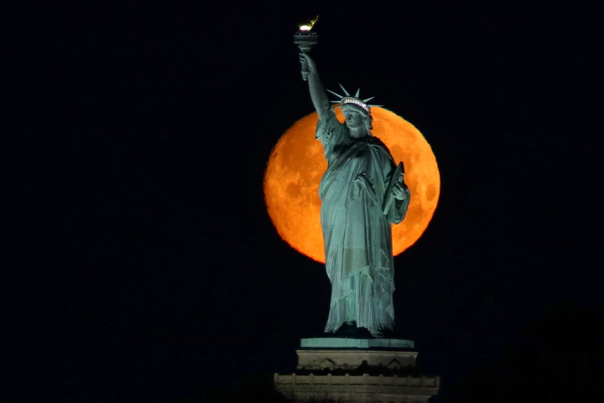 An almost full Super Worm Moon sets behind the Statue of Liberty in New York City Sunday morning #newyorkcity #nyc #newyork @statueellisnps @statueellisfdn #statueofliberty #superwormmoon #WormMoon @agreatbigcity