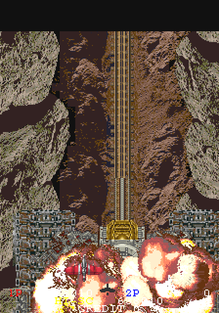 ガンクルーザが大爆発を起こし、これで全ての戦いが終わったと思ったその時、艦橋後方から不気味な一本の線路が伸び、眼下の線路と直結して巨大な棺桶が姿を現した。このラスボスが巨大な棺桶に入れられ運ばれて行くというのがガンフロンティアのセンスの良さ！カッコ良さ!!キチガイ的メタファー!!!