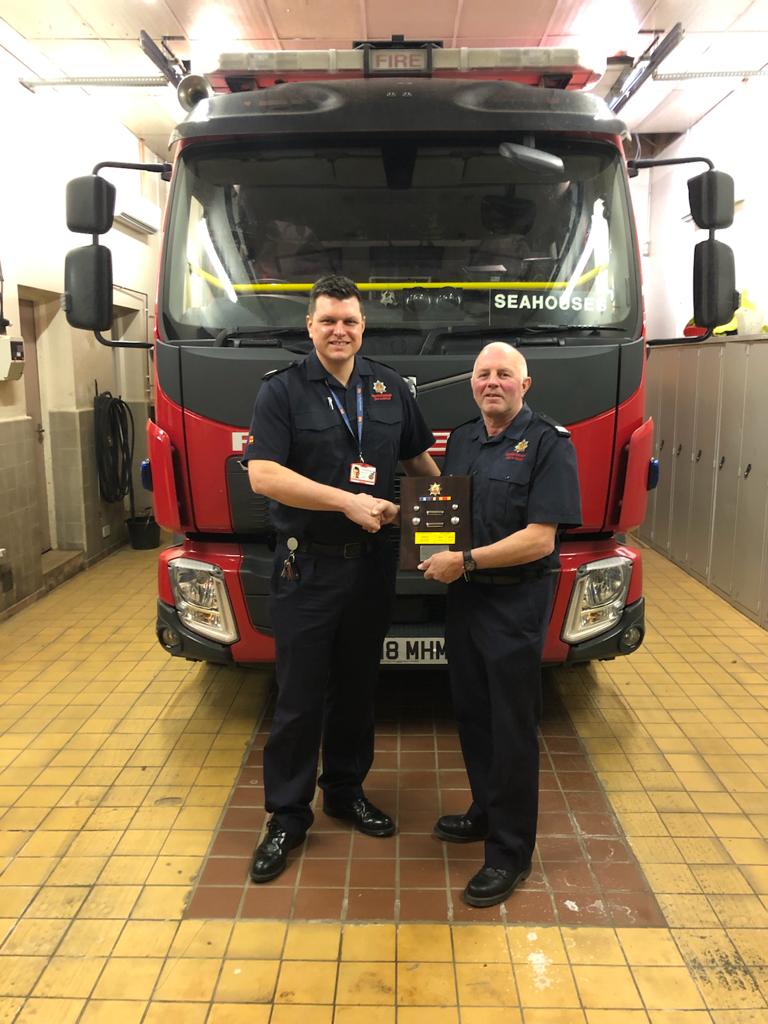 NlandFRS's tweet photo. Seahouses #oncall fire station said farewell to CM Dave Stanton. He has served the Seahouses community for 25 years. We wish him well for the future. He's pictured here receiving his plaque from GM Steve Kennedy. #knockoffmakeup #firefamily https://t.co/gtgMT16O0J