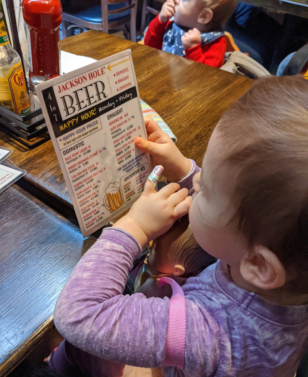 My daughter keeps her priorities straight when eating out.