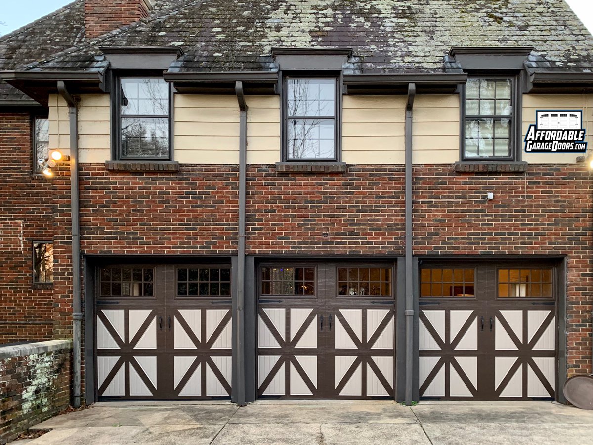 AfGarageDoors's tweet photo. We recently replaced some old wooden garage doors on a Tudor home in Birmingham, AL w/ steel two-tone carriage house @amarrgaragedoor from their Classica collection. The owner was delighted that they were able make the upgrade while preserving the home’s overall character &amp; charm https://t.co/KU1T7oPmRs