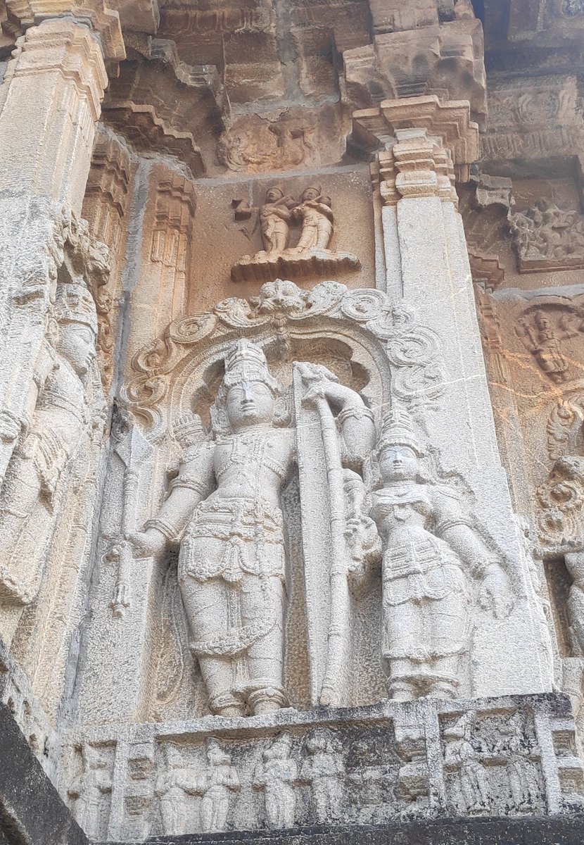 Lord Vishnu as Rama, accompanied by Sita. The diety on the side panel could be Lakshmana. Identifying becomes easy with the monkeys in the panel below the gods feet.