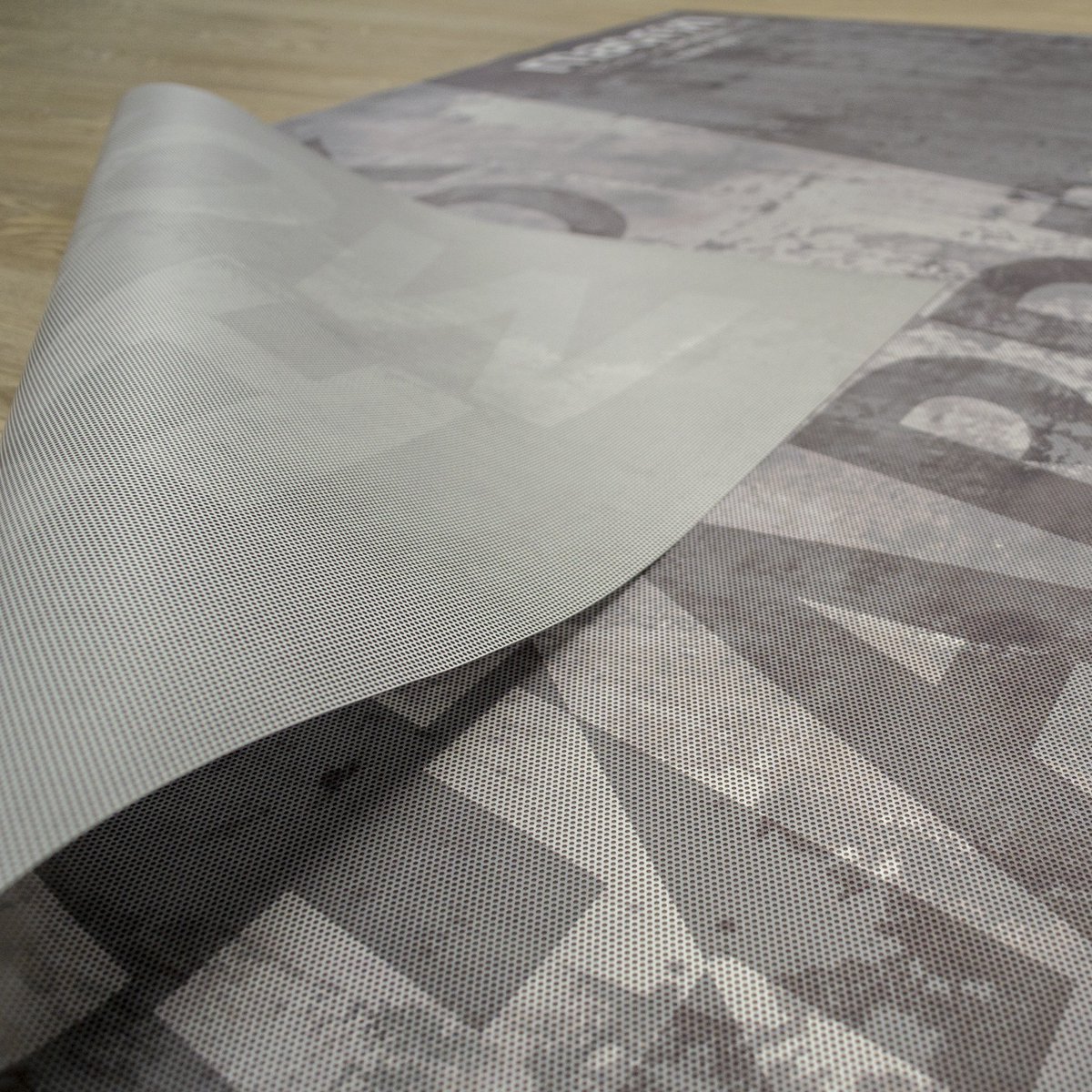 Adhesive vinyl contravision has honeycomb holes, allowing see through from the inside, creating a feeling of light and space. Macron Store Manchester sportswear commissioned Carrick to produce printed in store vinyls for windows to create a dramatic sales environment.