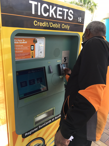 Here is a #SunRail Ambassador following the #coronavirus virus protocol and sanitizing a ticket vending machine
