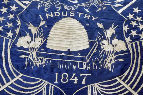 UTStateCapitol's tweet photo. Happy State Flag Day! Today we are showcasing Utah’s first flag, made in 1903. Don’t you think the blue silk and white embroidery are beautiful? #utah #utahstatecapitol #utcapitol #slc #tours #docent #volunteer #slcvolunteer https://t.co/FzncL13aEs