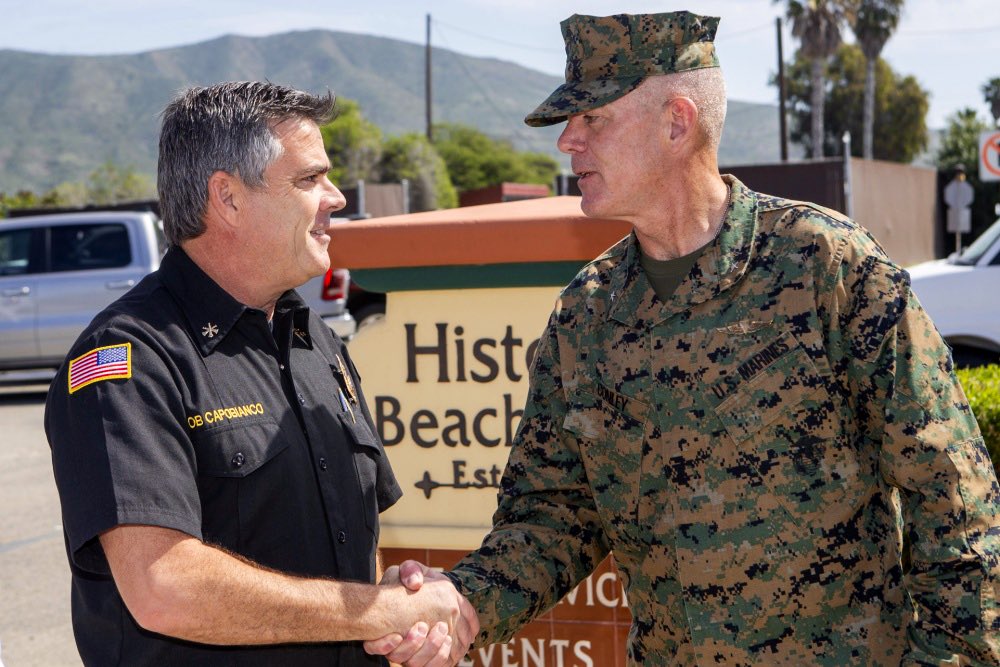 MCIWPendletonCA's tweet photo. Brig. Gen. Dan Conley, CG, Marine Corps Installations West, Camp Pendleton, greets Chief Rob Capobianco, fire division chief, San Clemente, during the City of San Clemente Luncheon at the San Onofre Beach Club here. #SupportingNeighbors 

See more:
https://t.co/hvsODpZmY5 https://t.co/I6ZlYnpTs3