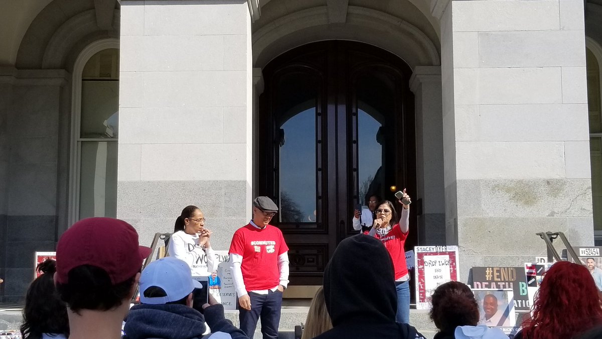 Barbara Chavez speaks to the crowd urging #DROPLWOP