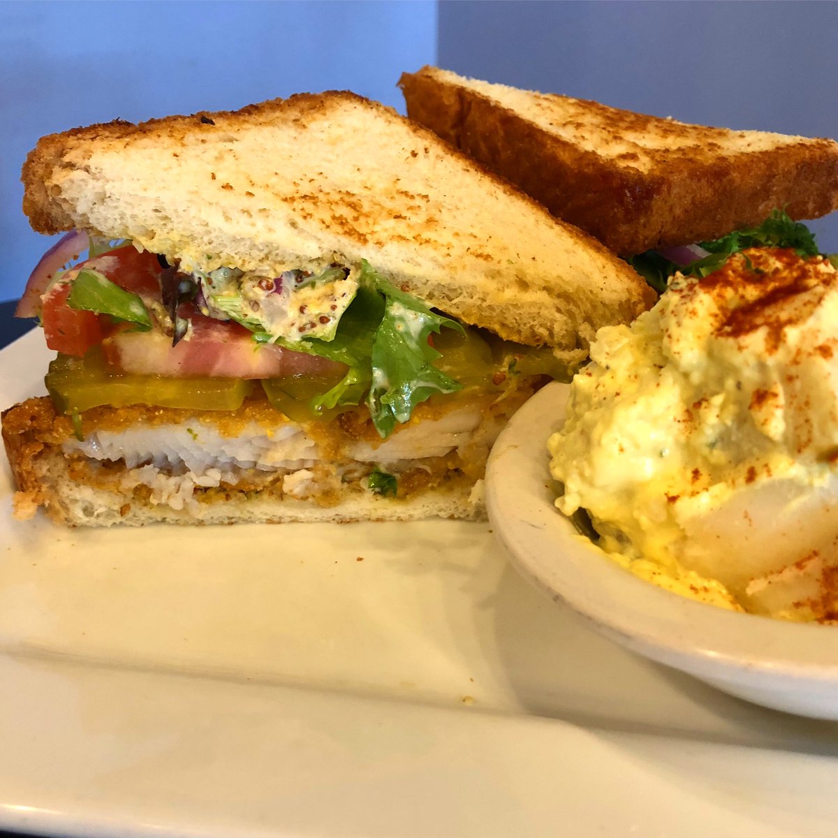 FISH SANDWICH — fried fish, lettuce, tomato, tartar sauce, pickle, and red onion $10.99 with side and served through lent!