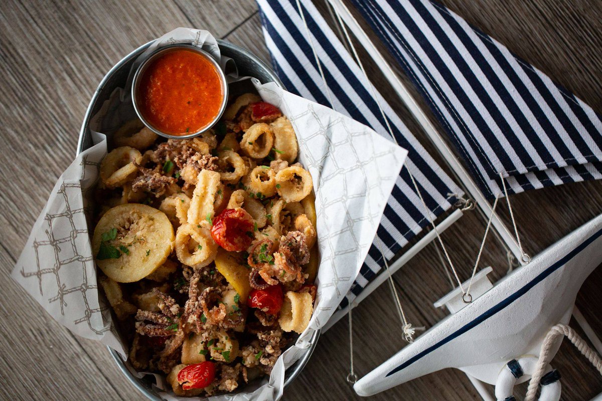 Sail through the day with this crispy #calamari with peppadew #peppers, lemon, and #harissa dipping sauce!