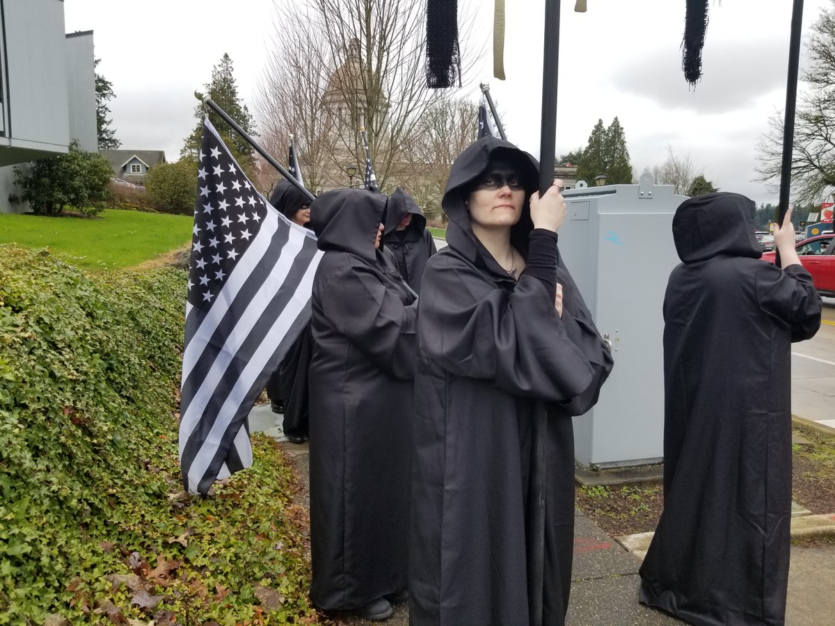 TST_Washington's tweet image. Scenes from the Satanic Invocation at Washington State Capitol

Christian nationalists arrived in protest &amp;amp; attempted to invoke the name of their god against the chapter's beautiful expression of religious freedom, but they were powerless to stop our unholy rites

Hail Satan
^ADJ
