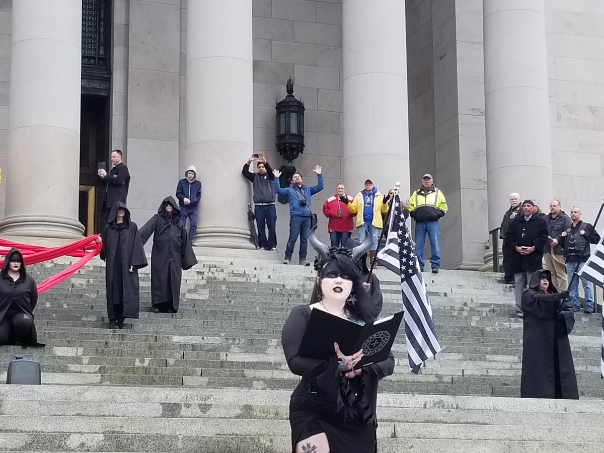 TST_Washington's tweet image. Scenes from the Satanic Invocation at Washington State Capitol

Christian nationalists arrived in protest &amp;amp; attempted to invoke the name of their god against the chapter's beautiful expression of religious freedom, but they were powerless to stop our unholy rites

Hail Satan
^ADJ