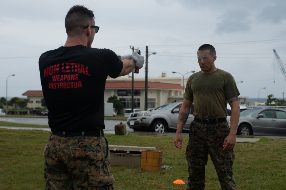 USPACOM's tweet photo. U.S. @PacificMarines with Alpha Company, #3MARDIV under the Unit Deployment Program, familiarized themselves with the oleoresin capsicum #OCSpray portion of non-lethal weapons training on Camp Schwab, Okinawa, Japan. #OCOCOC #Readiness #RiotControl #FreeandOpenIndoPacific https://t.co/wN8TZFo0vK