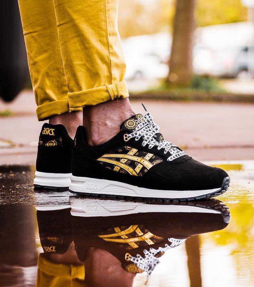 black and gold asics tigers