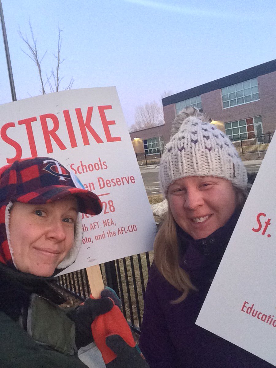 MsLanners31's tweet photo. Two @UTSWCSchools teachers spending a Spring Break morning joining @SPFE28 on the picket line. Give St. Paul kids what they need! #WeAreSPFE #WeAreSPPS https://t.co/rSIpTWBTLZ