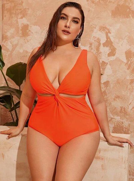 Stand out this summer in this bright, bold one piece plus size swimsuit featuring a twisted front and bold orange color. Material offers high stretch. #plussizeswimsuit #plussizeswimsuits #plussizefashion #plussizeclothing #plussizeboutique #curvyfashion #curvyclothing #curvy