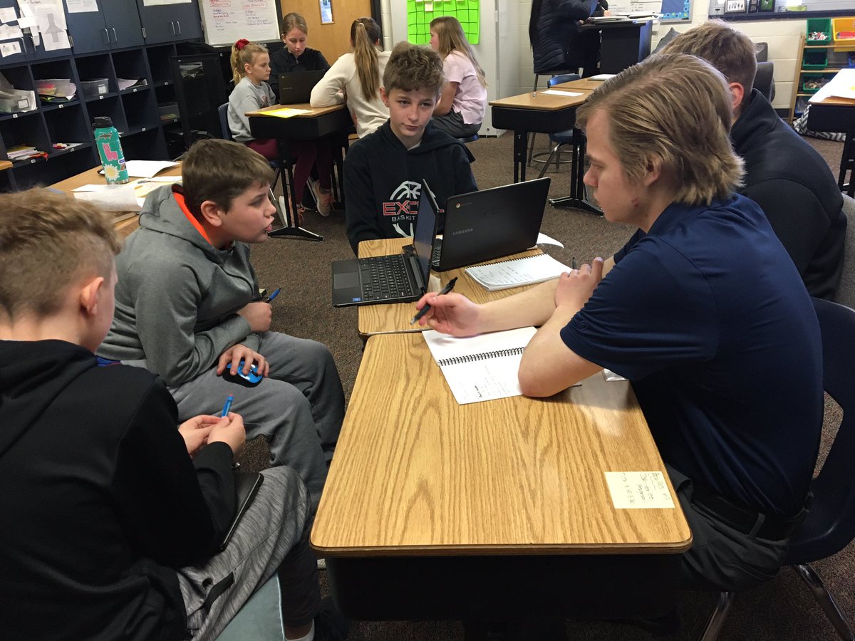 CAPS associates working with Mr. Switzer’s 6th graders on their STEM Innovator projects.