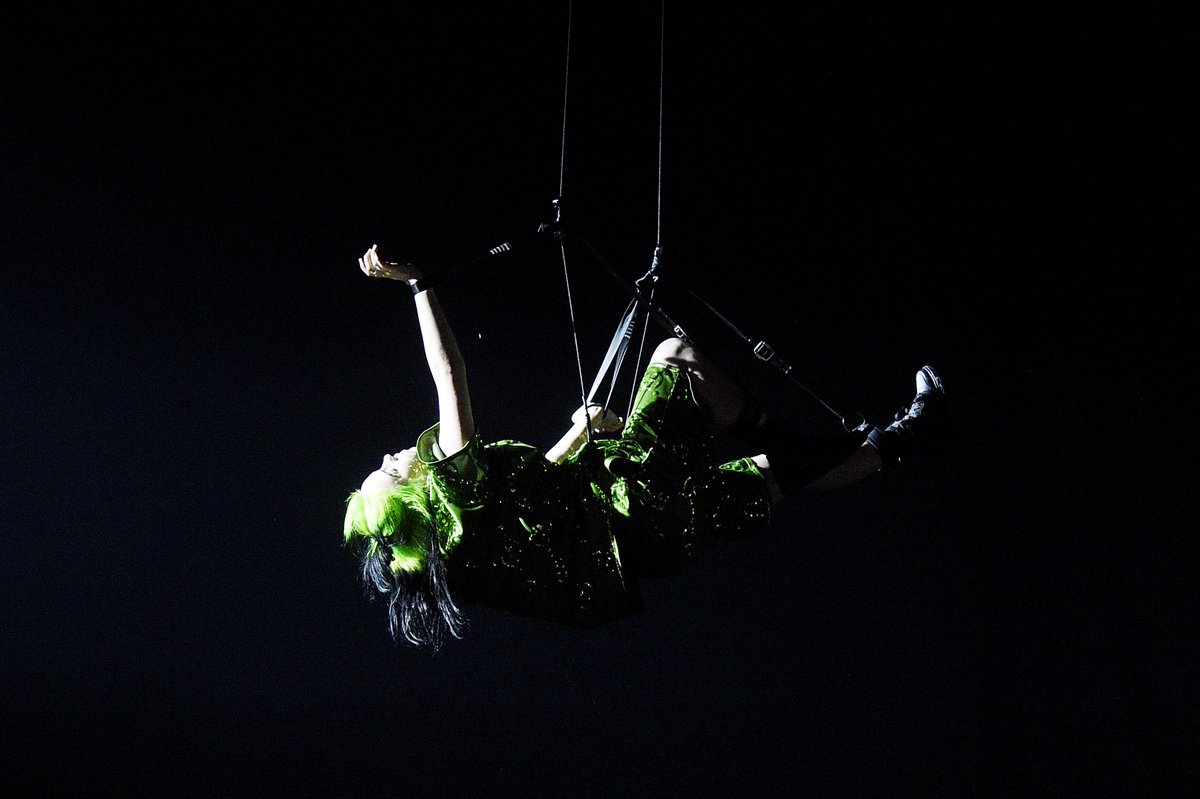 MTV's tweet photo. .@billieeilish kicked off her #WhereDoWeGoTour last night! Can we talk about THESE VISUALS?? 💚🔥 https://t.co/XLw3O5Aekq