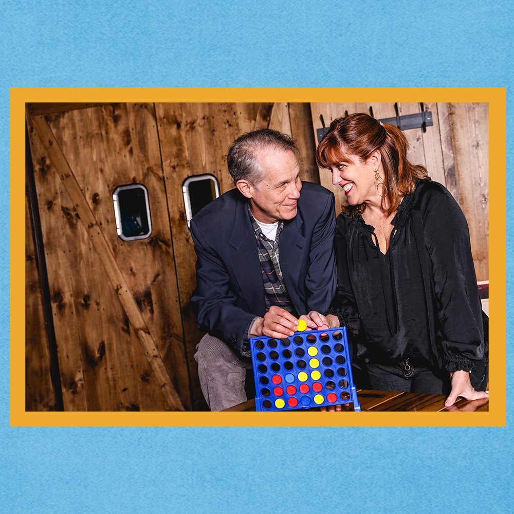 Photo of Actors who play Nick in Diane in the Broadway production of Come From Away playing connect four