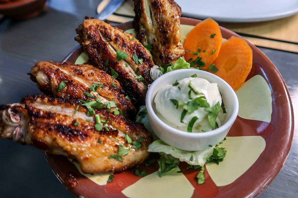 Everybody loves a good chicken wing…

We serve ours charcoal-grilled, with a garlic sauce dip. Find this dish on our menu by searching for  ‘Jaweneh’ on our list of delicious Hot Mezze starters. 😋