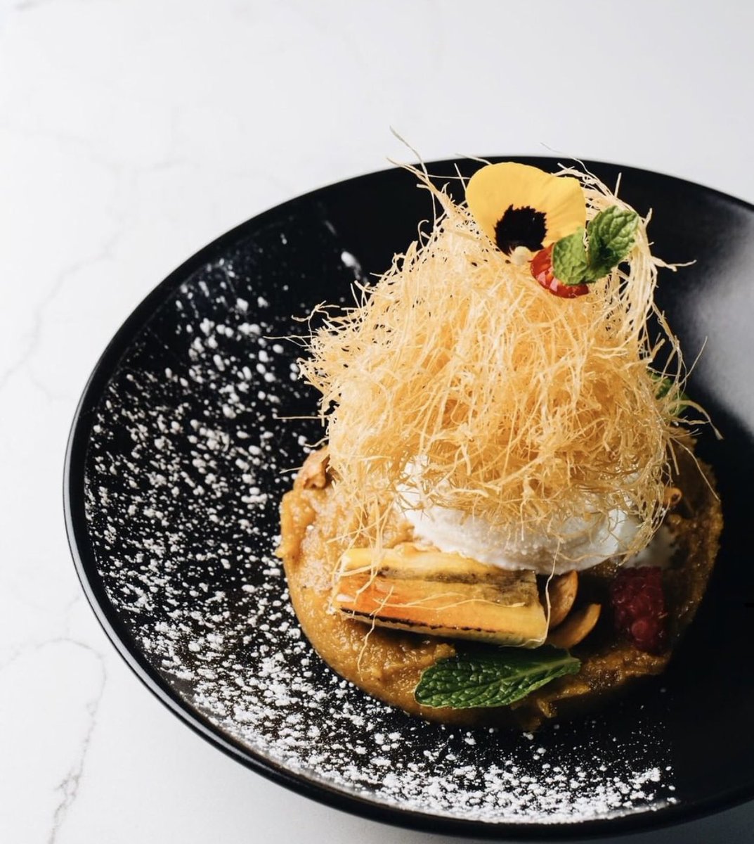 Jack-of-all-trades, master of one: our jackfruit sundae puts a masterful spin on dessert by combining velvety coconut ice cream and caramelized jackfruit with the flavor and texture of crispy angel hair. Have you ever had this exotic fruit native to South India? #RasaIndian