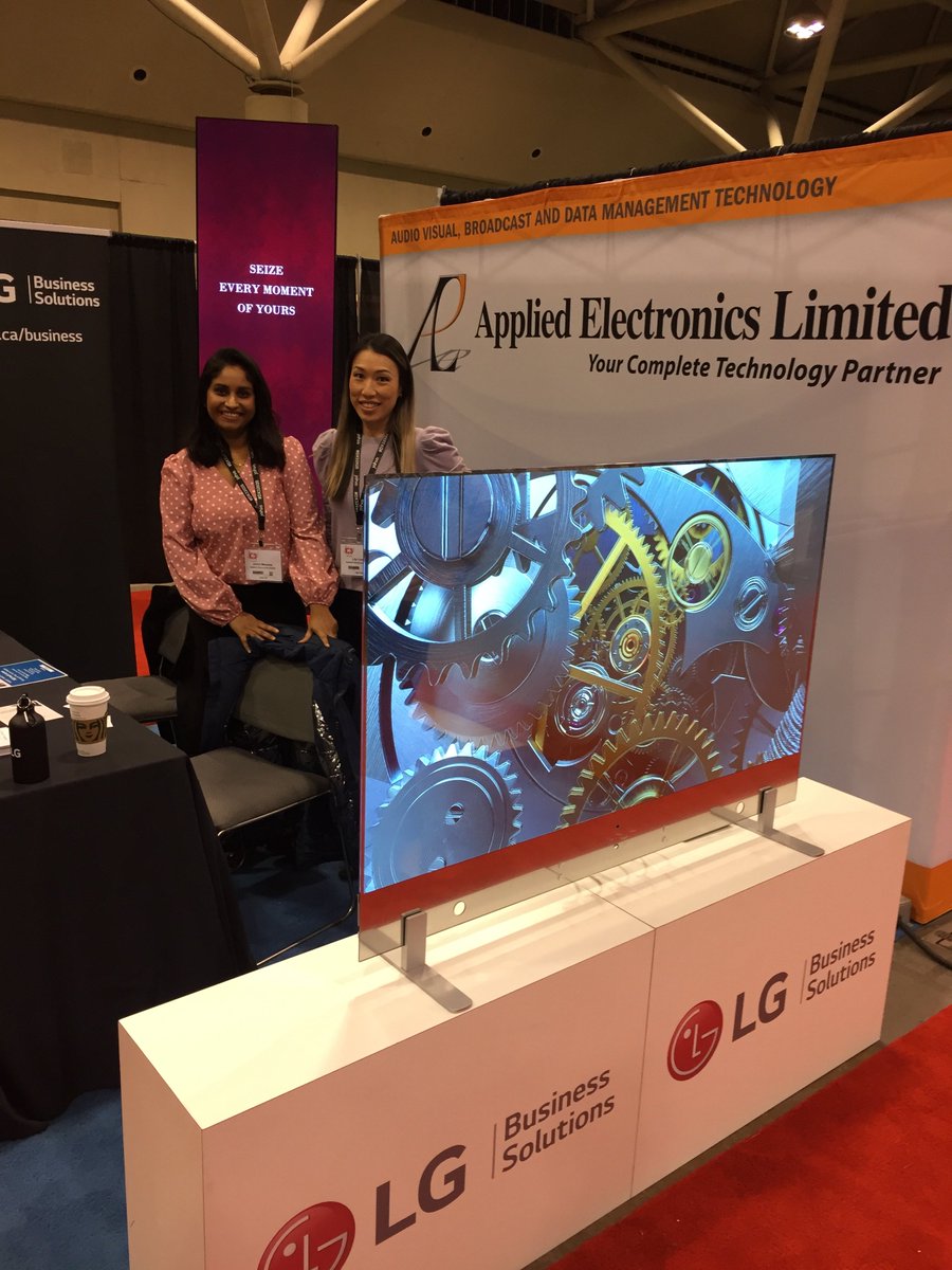 busy_b1969's tweet photo. Lily and Janice from Applied Electronics Limited, with my dream screen. I’ve never referred to a TV as “sexy”....until now. LG's 'Transparent' line ....just wow....

@applied_tweets
@LGCommDisplays
@LGUS
#DX32020 https://t.co/86kDqniQ0t
