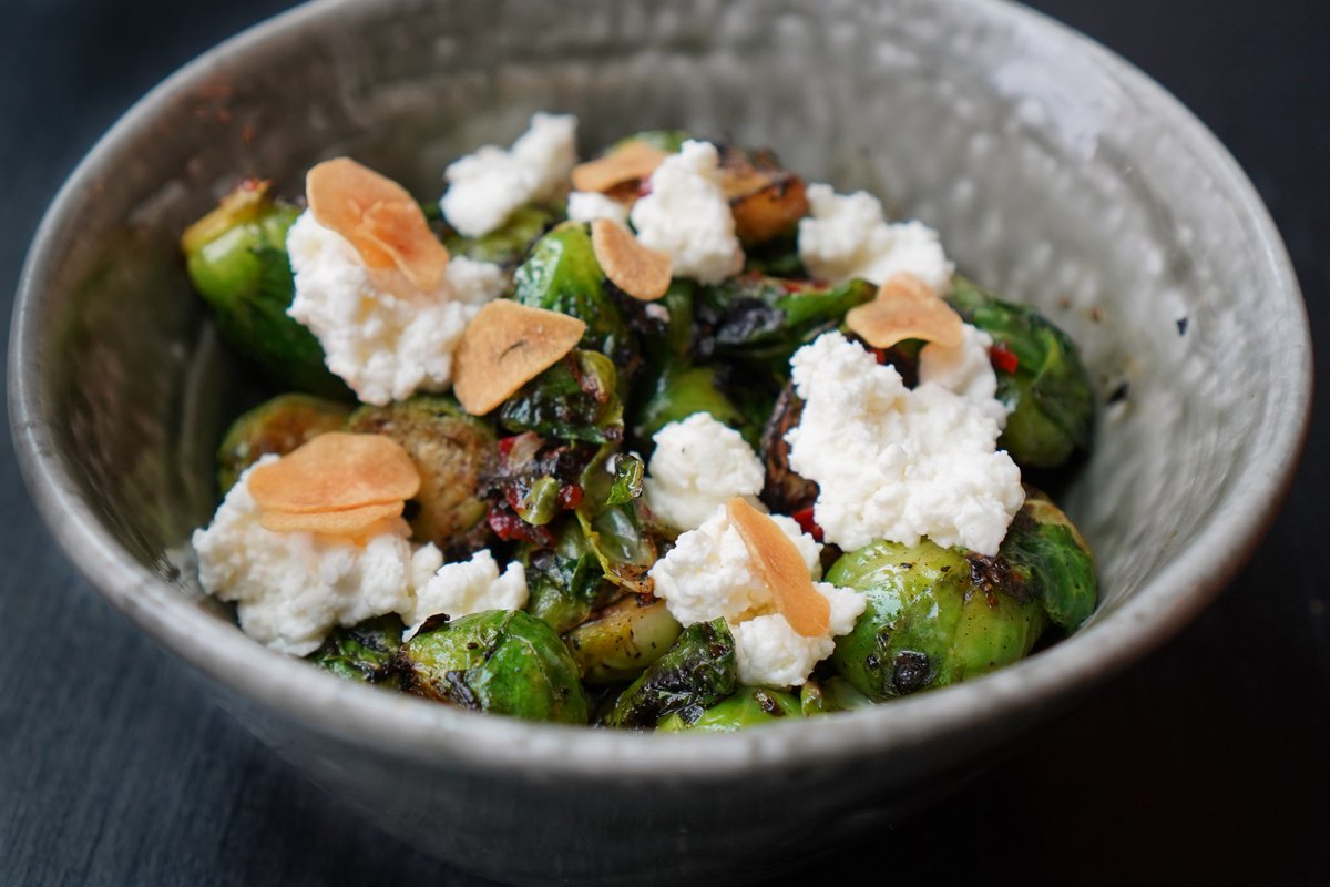 Brussels sprouts are one of our favorite vegetables to give the grill treatment. We char them in the wood fire, then pair them with Fresno chiles and ricotta--crispy, spicy, creamy, and vegetal.
