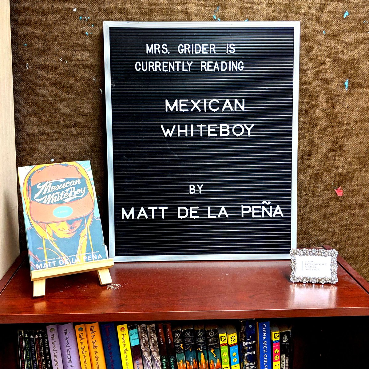DonorsChoose's tweet photo. Last week, @mrs_g_rider, posted her “Poetry Isn’t Scary” project and it was funded during #FillEveryShelf. We love her idea of sharing books she’s reading with her students. "A student I don't know walked by my classroom, saw my board, and is now interested in reading this book.” https://t.co/AcaXRgipEy