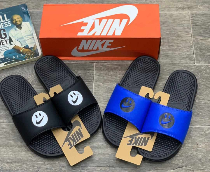 nike slides with smiley face