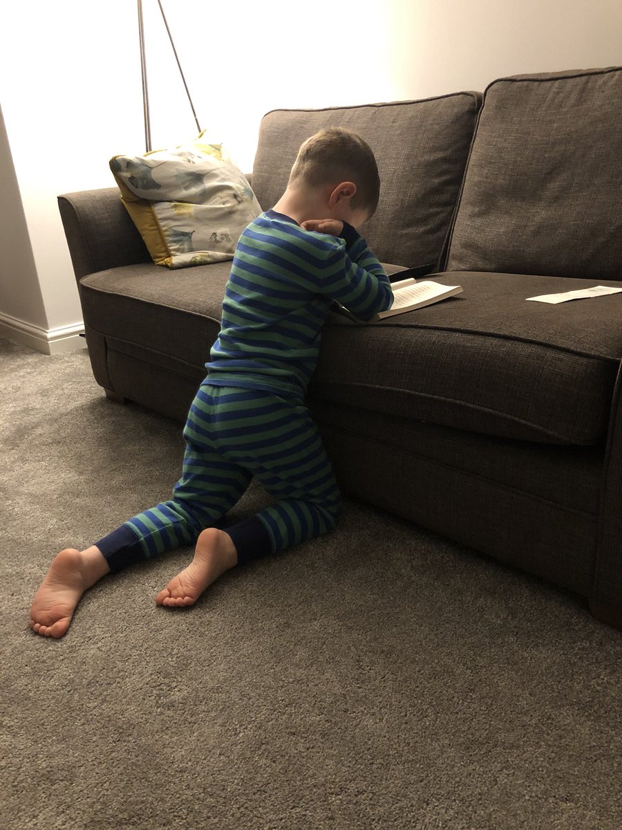 Jolomax2's tweet photo. Our 5 year old enjoying his extra hour before bed due to no school get up. Absorbed by @tompalmerauthor βs Football academy. #footballmad #greatreader https://t.co/38P38jKnFU