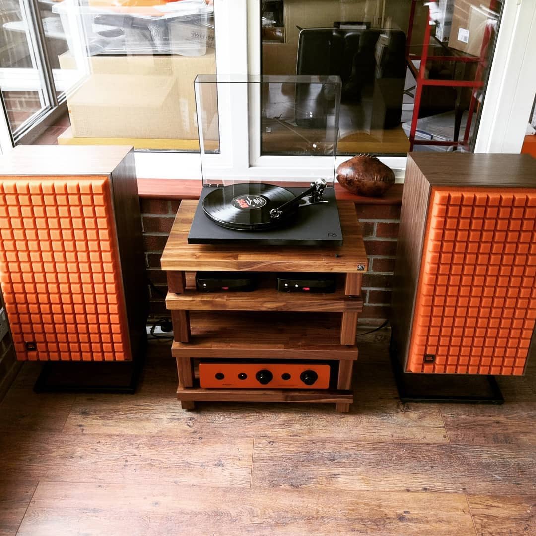 HiFiRacksLtd's tweet photo. A @rayleighhifi client with a passion for the colour orange was looking for a new system... Here's their stunning install ft @jblsynthesis, @SugdenAudio, @RegaResearch, @TelluriumQ and a solid walnut Hi Fi Racks Podium Reference, for acoustic performance like no other. https://t.co/kzr0C6oXWD