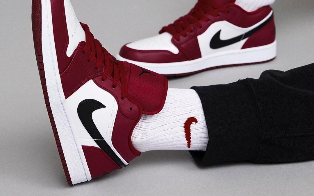 jordan 1 low noble red on feet