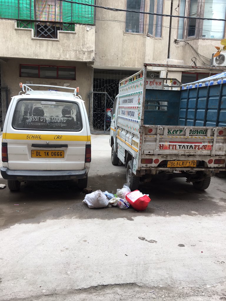 shaaline's tweet photo. Garbage lying on the street and the sweeper not cleaning it @MLA_Mehrauli @delhimc. How can people avoid falling sick. #coronavirusindia is not the only enemy! https://t.co/XUd9FIofJI