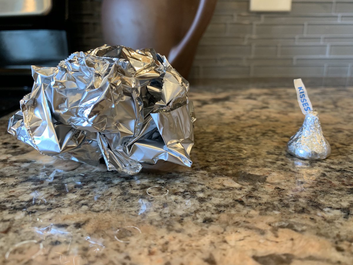 One of these has a Hershey’s Kiss inside and one has an owl pellet. They are both on our kitchen counter. The kids need to go to school soon. 😐