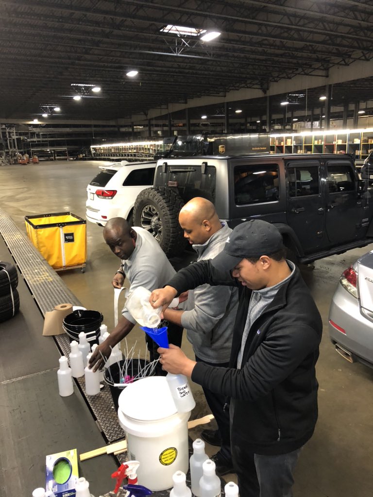 Richmond RMP Julian Burchett filling bleach/water spray bottles to keep the inside of the Package cars clean. #UPSersAreThere