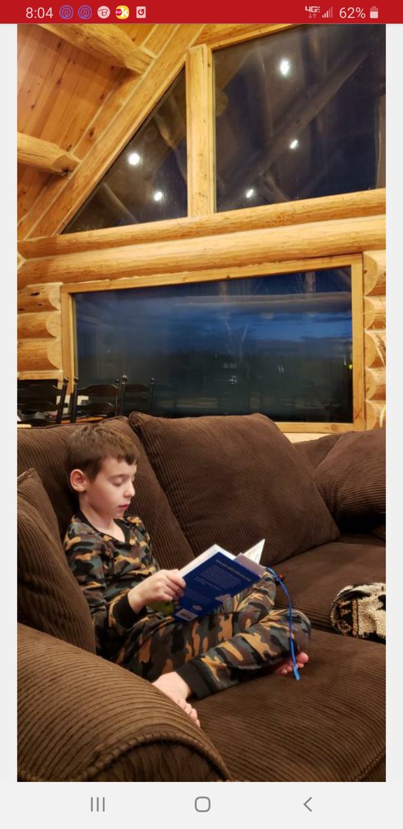 SummitMv's tweet photo. Jacob loves to read! PJs make it even easier to curl up with a good book! Miss you, Jacob! #summitmv #mvisspirit ⁦@MVR5Schools⁩ ⁦@SummitMv⁩ https://t.co/uq419BNFat