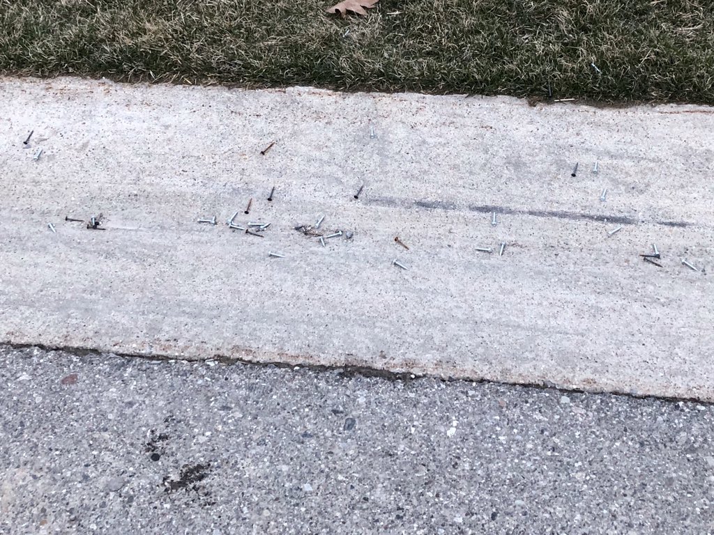 tabologist's tweet image. Not cool @WadeJurneyHomes over 100 nails and screws in my front yard today. Hopefully no one got one stuck in their tire. And is home construction an essential business?