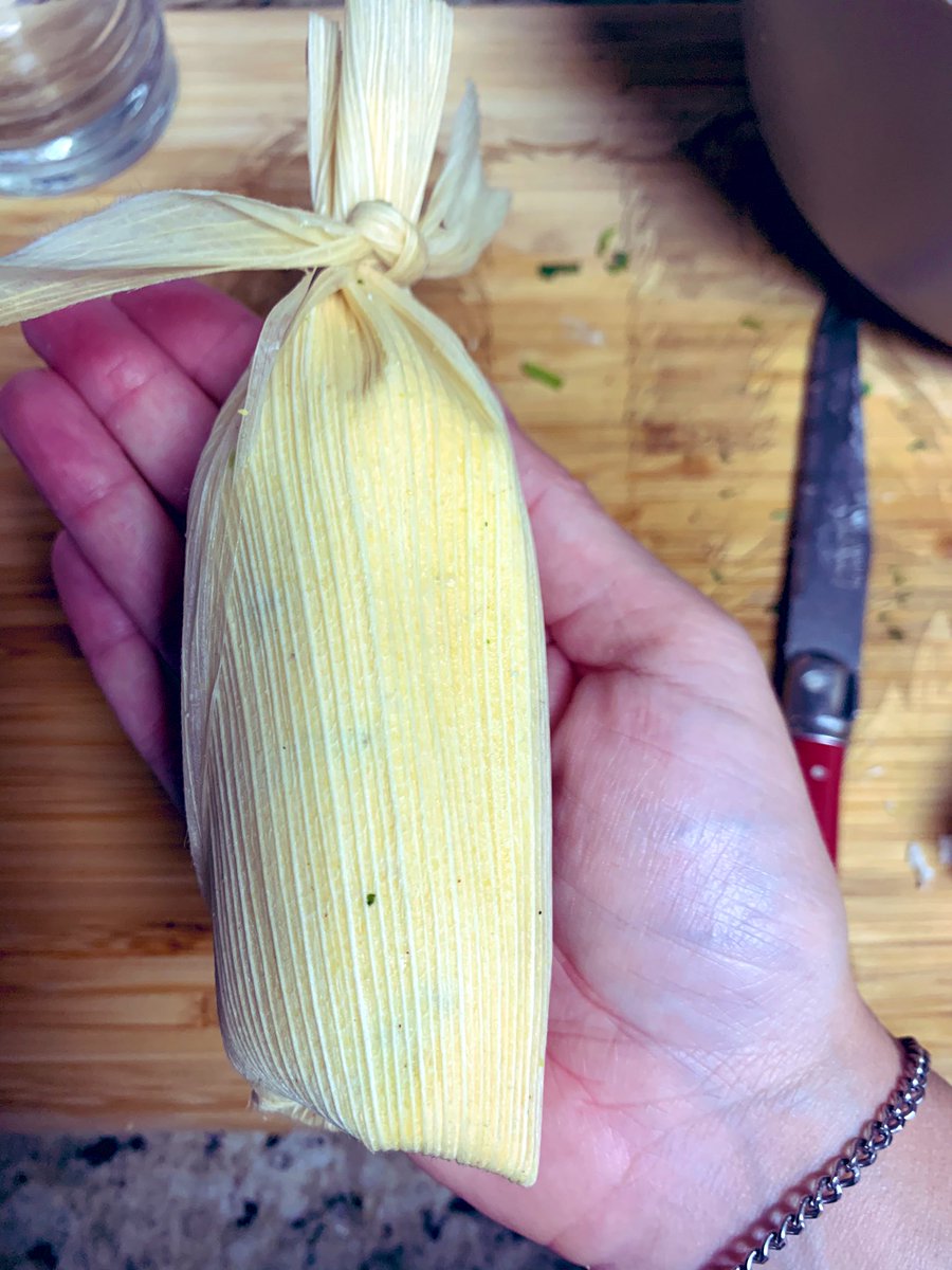 Other main points. Those corn husks need to be soaked for real or they rip. Roll the tamales so the corn rolls all the way around the filling. You can use the husk like a sushi rolling mat, which yeah, culture clash, but I grab from everywhere when I cook.