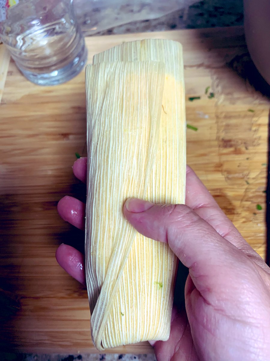 Other main points. Those corn husks need to be soaked for real or they rip. Roll the tamales so the corn rolls all the way around the filling. You can use the husk like a sushi rolling mat, which yeah, culture clash, but I grab from everywhere when I cook.