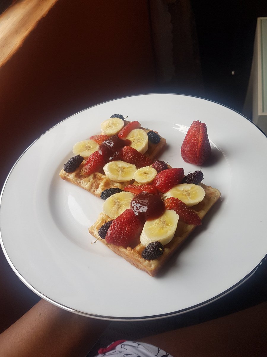 Quarantine cuisineMulberry, strawberry and banana on waffles with berry coulis