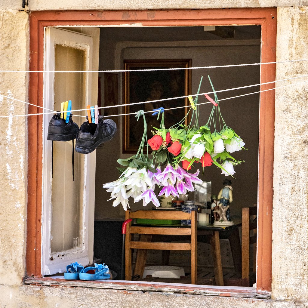 Flowers and shoes in a Lisbon window. #DreamingOfTravel